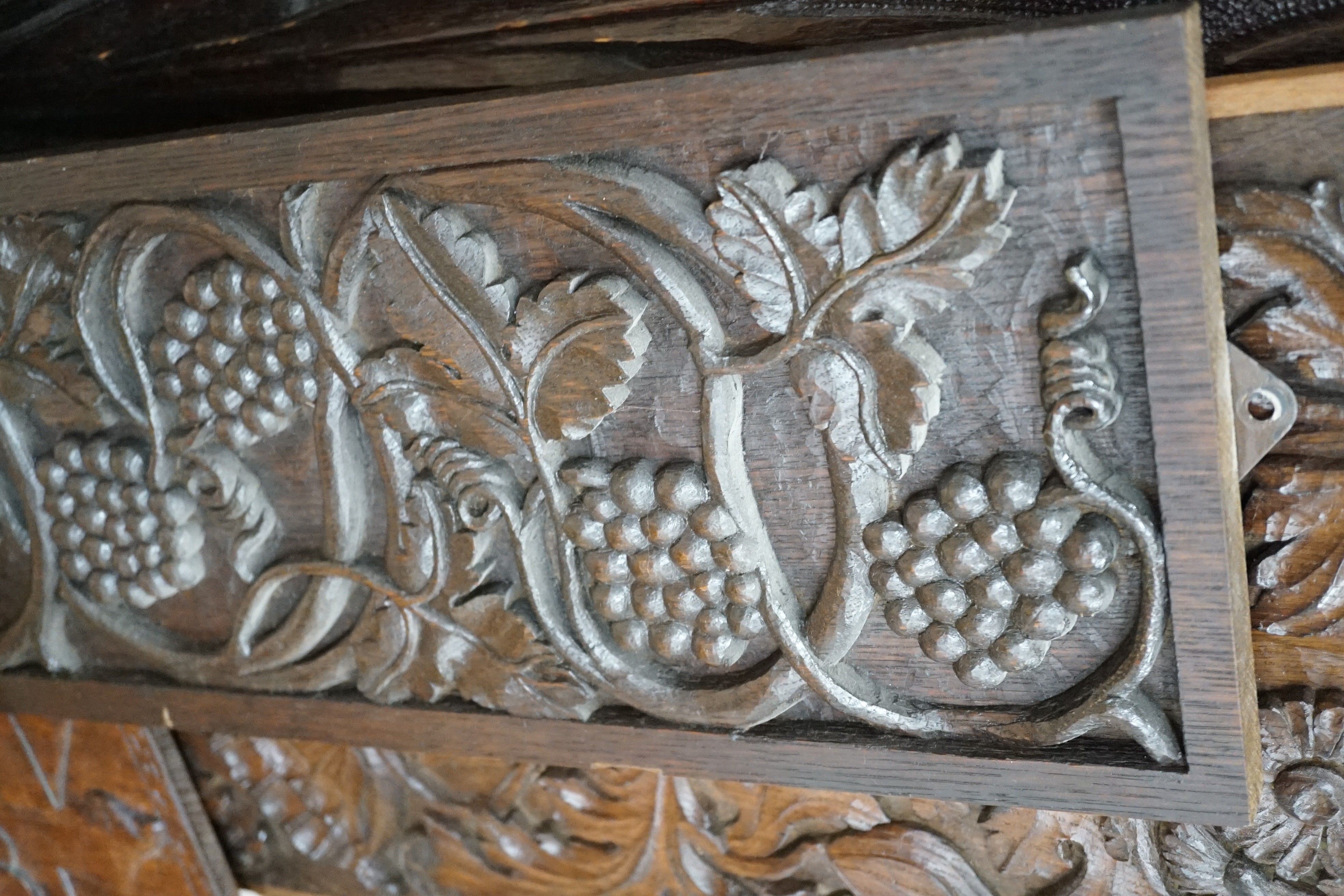 Seven assorted carved wooden panels, widest 166 cms